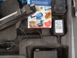 a tool box with a stapler, stapler, stapler, and other items in it
