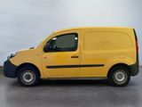 a yellow van that is parked in a parking lot