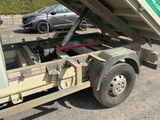 a dump truck that is parked in the parking lot