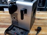 a coffee machine that is sitting on a wooden table
