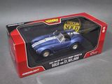 a box with a toy car in it on a table