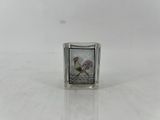 an image of a small glass block with a picture of a rooster on it