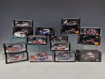 a lot of different model cars in a display case