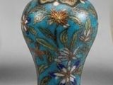 two vases sitting next to each other on a table