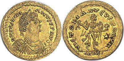a gold coin with an image of a woman on it