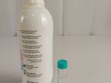 a bottle of baby lotion next to a small bottle of baby lotion