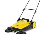 a close up of a yellow and black sweeper on a white background