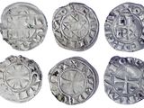 six pièces d'argent de formes et de tailles différentes