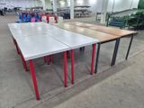 two tables that are sitting in the middle of a room