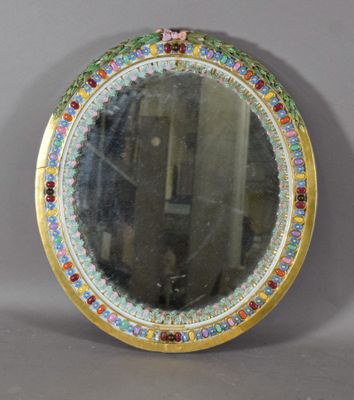 an image of a round mirror with a colorful border around it