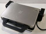 a laptop that is sitting on a table with a charger