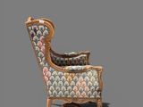 an image of a chair with a colorful upholstered upholstered back