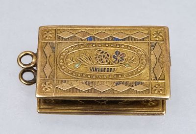 an image of a small gold box with a crown on it