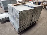 several stacks of steel plates stacked on top of each other in a warehouse