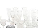 a lot of wine glasses that are sitting on a table