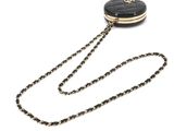 black and gold chain purse with a chain around it
