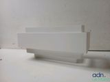 a white planter sitting on a table with a white background