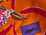 an image of a close up of a scarf with a picture of a woman on it