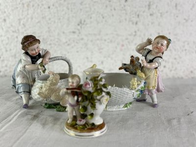 two figurines that are sitting on a table