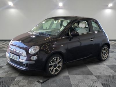 a picture of a small black car on a checkered floor
