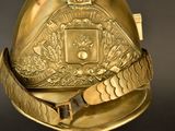 a gold helmet with a gold belt around it