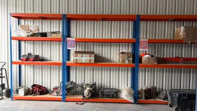 a room with a lot of shelves that have various items on them
