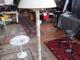 a lamp that is sitting on a table in a room