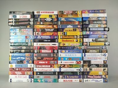a lot of dvds stacked on top of each other