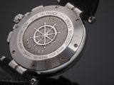 a close up of a wrist watch with a compass on it