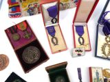 many medals and medals on display on a table