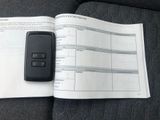 a cell phone sitting on top of an open book