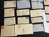several old letters and envelopes sitting on a table with a black background