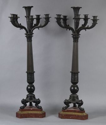 pair of antique bronze candelabs on marble bases