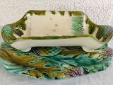 a green and white dish with pineapples on it
