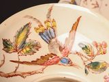 a white bowl with a bird design on it