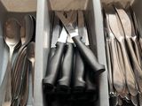 many spoons, forks, and spoons in a drawer