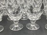 a lot of wine glasses sitting on a table