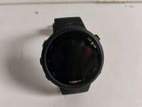 a close up of a smart watch on a white surface