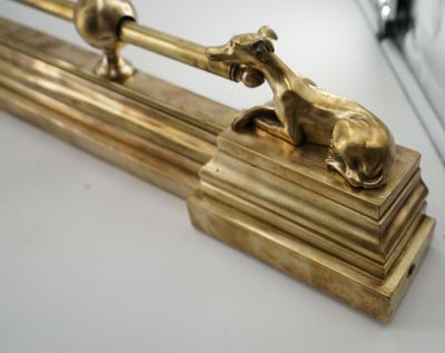 a gold statue of a horse and a dog on top of a table