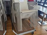 many chairs that are on wheels in a room