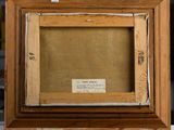 an old picture of a wooden frame with a label on it