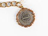 an image of a gold chain with a coin attached to it