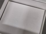 a box with a ring inside of it on a table