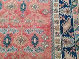 an old rug is laying on the floor in a room