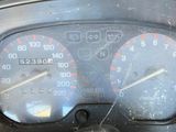 a close up of a speedometer on the dashboard of a motorcycle