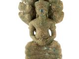 an image of a statue of a woman with a hat on her head
