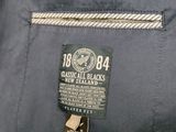the back of a jacket with a label on it