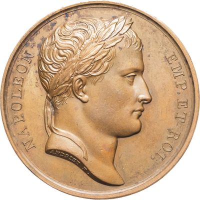 une image d'une pièce d'or avec le profil d'un homme