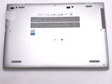 a close up of a silver laptop with a blue sticker on it