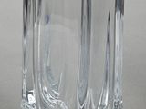 a glass vase that is sitting on a table